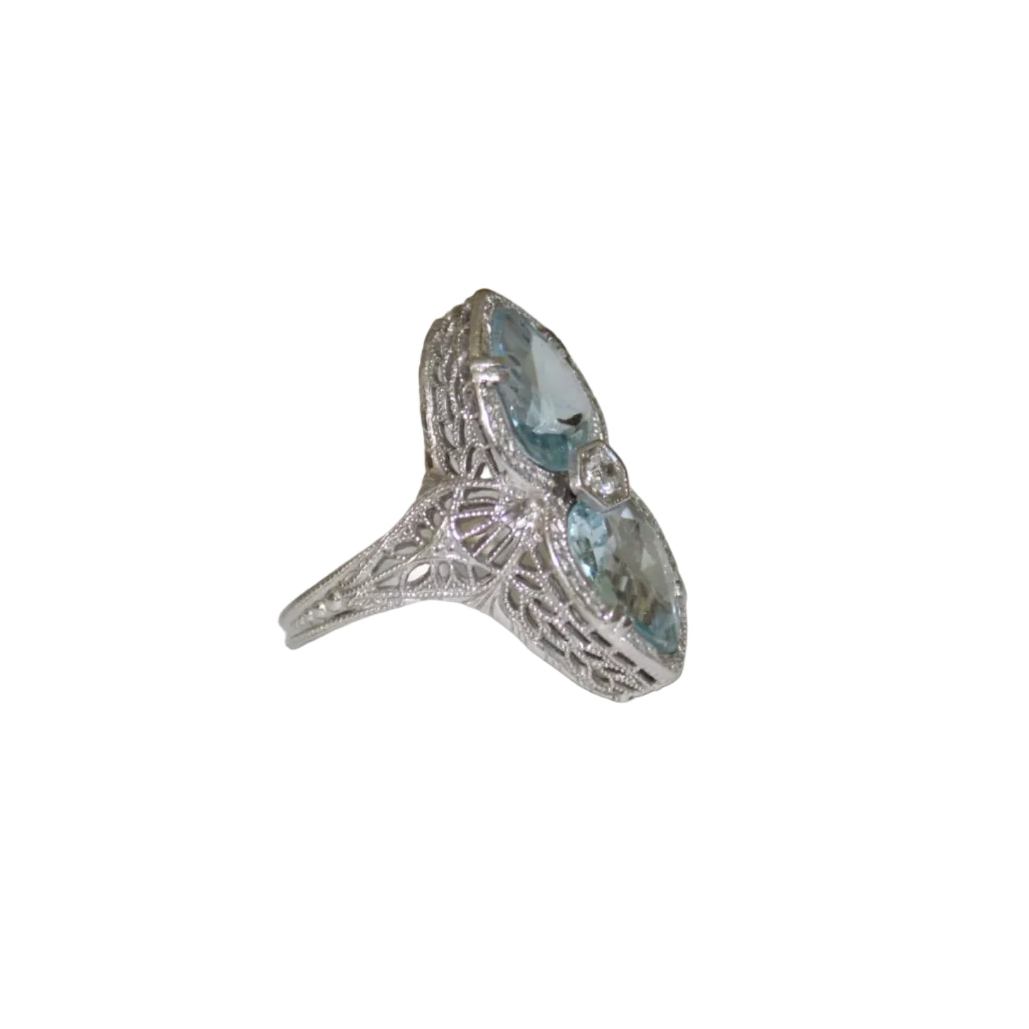 Silver ring with a blue gemstone on a white surface