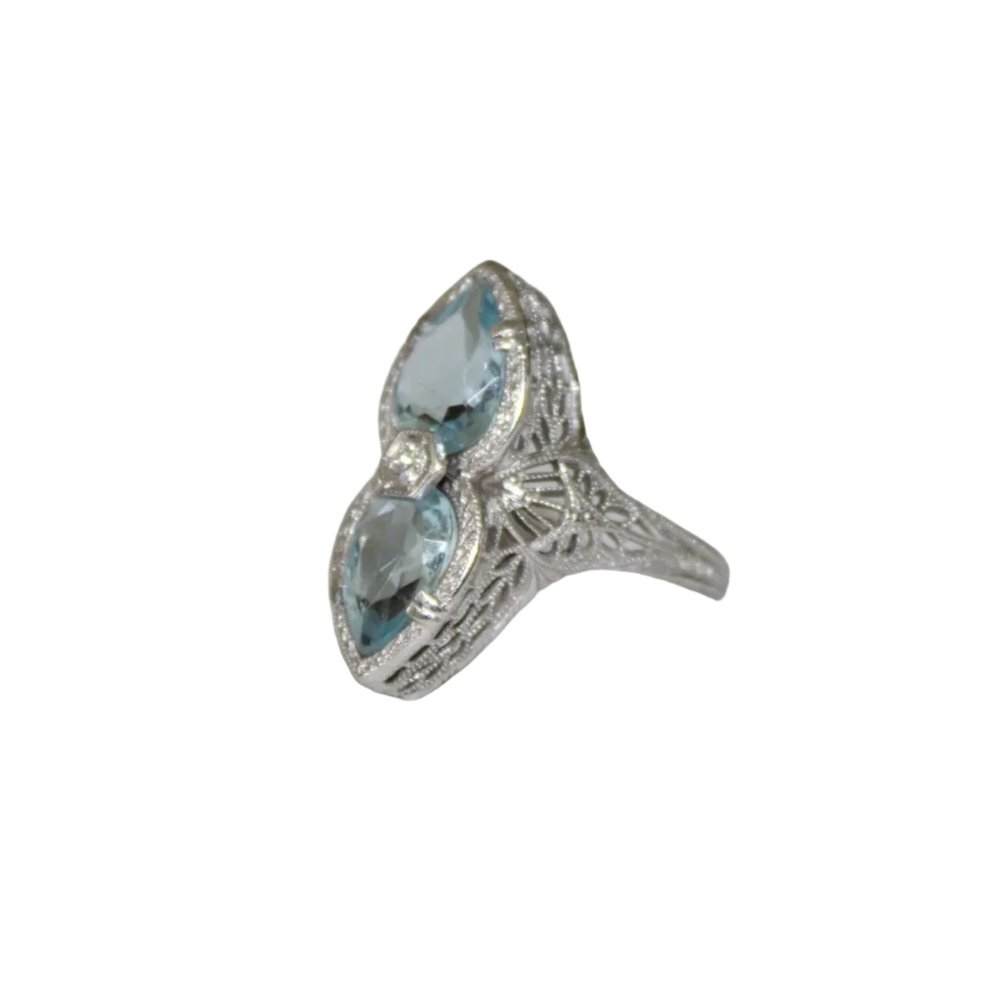 Silver ring with blue gemstones on a white surface