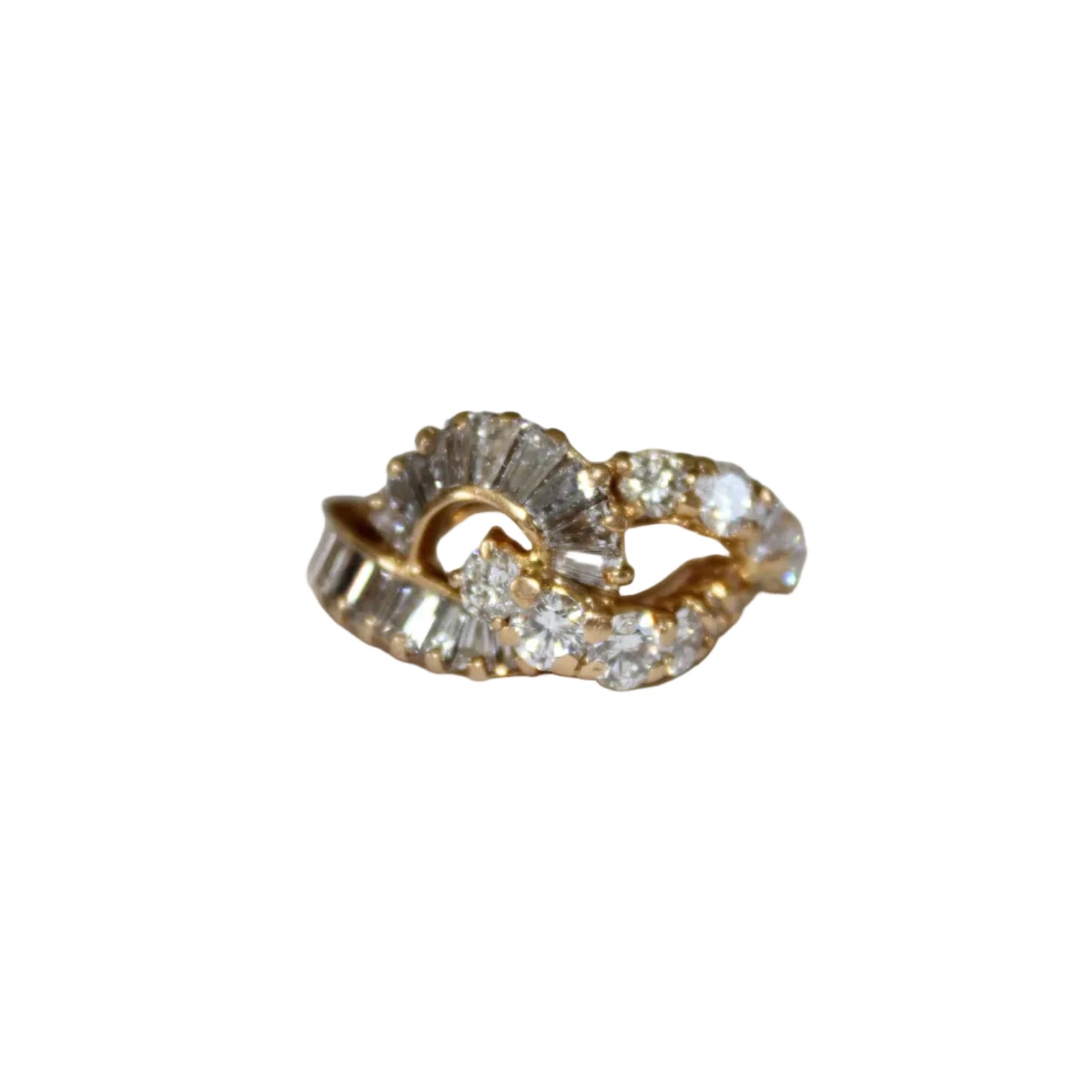 Gold ring with diamond accents on a light gray background