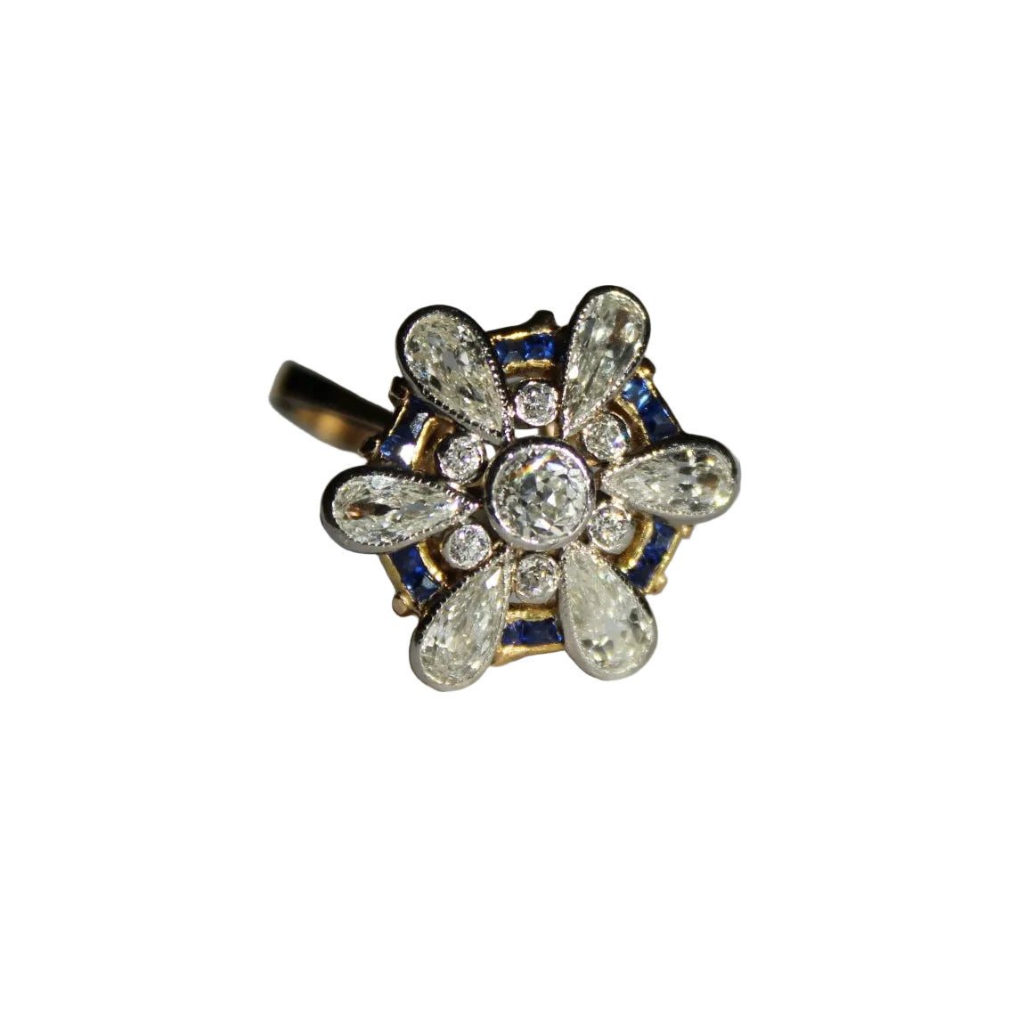 Gold ring with diamond and blue gemstone design on a white background