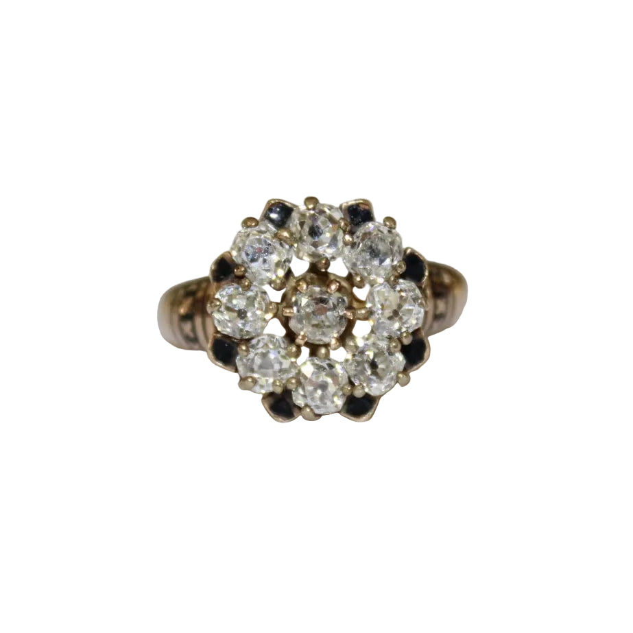 Gold ring with diamond cluster on a white background