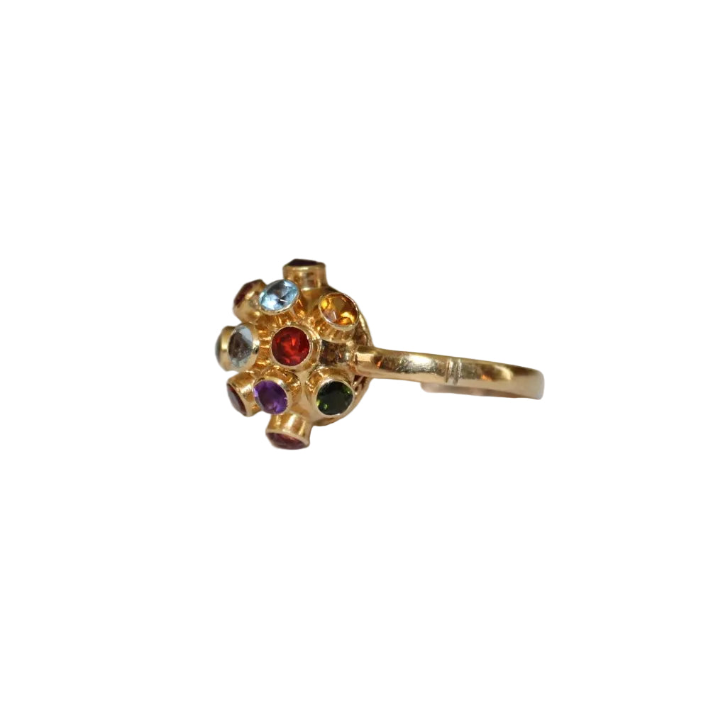 Gold ring with colorful gemstones on a white background