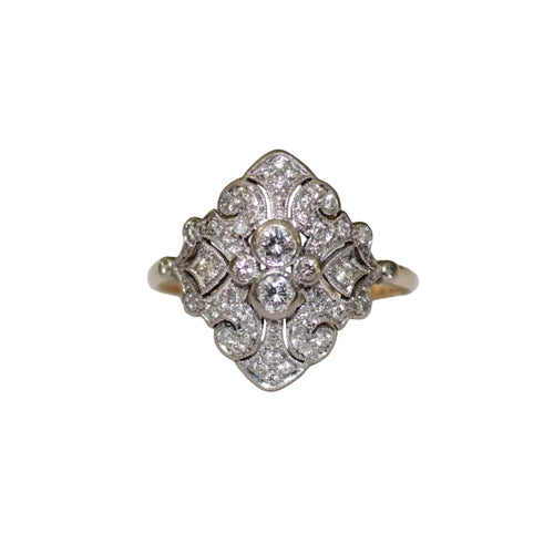 Diamond ring with intricate design on a white background