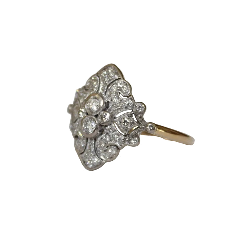 Diamond ring with floral design on a white background