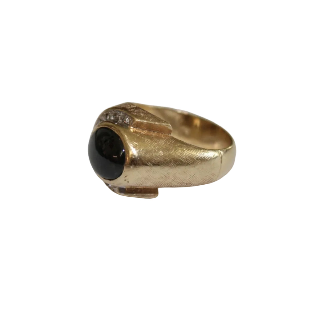 Gold ring with a black gemstone on a white background