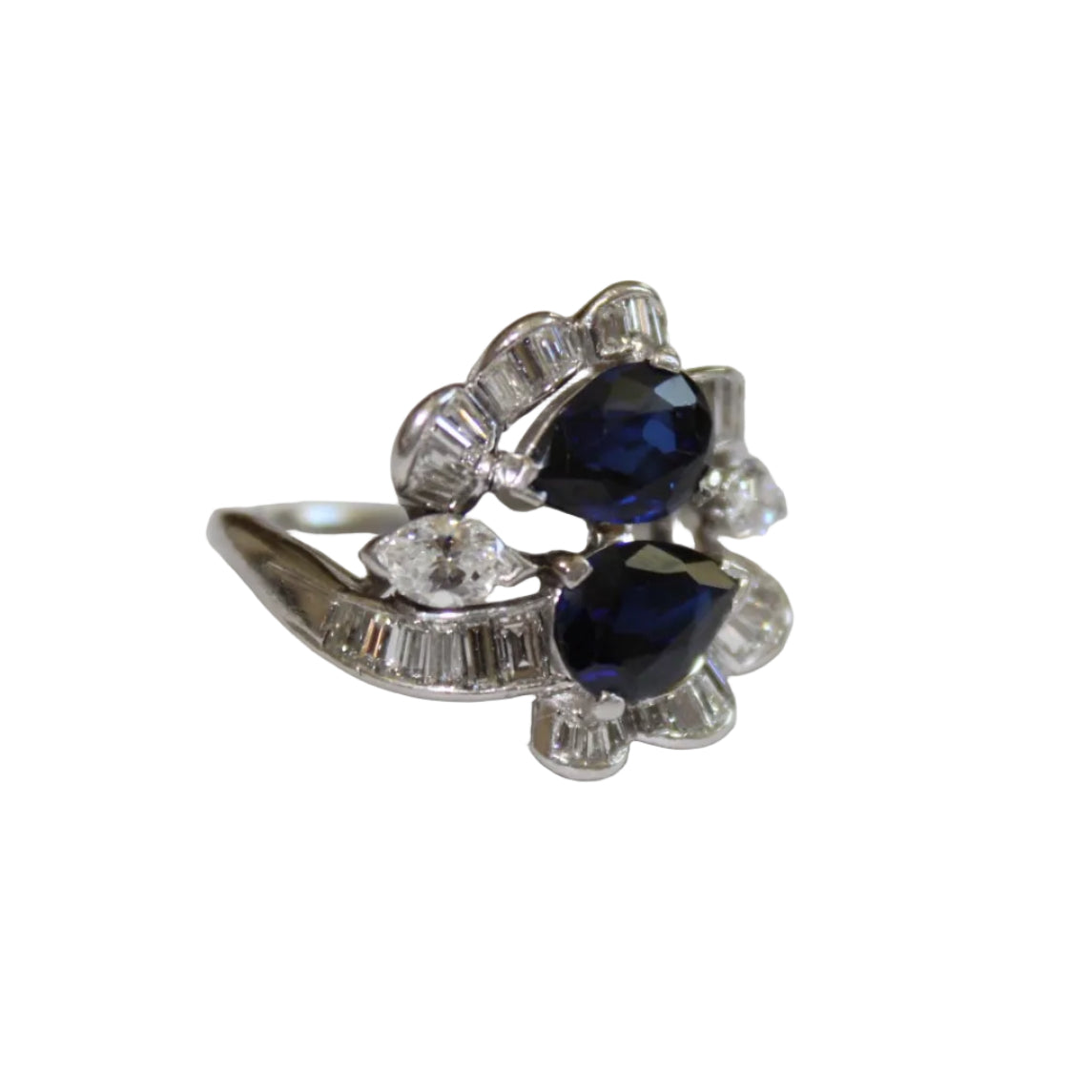 Silver ring with blue gemstones on a white background