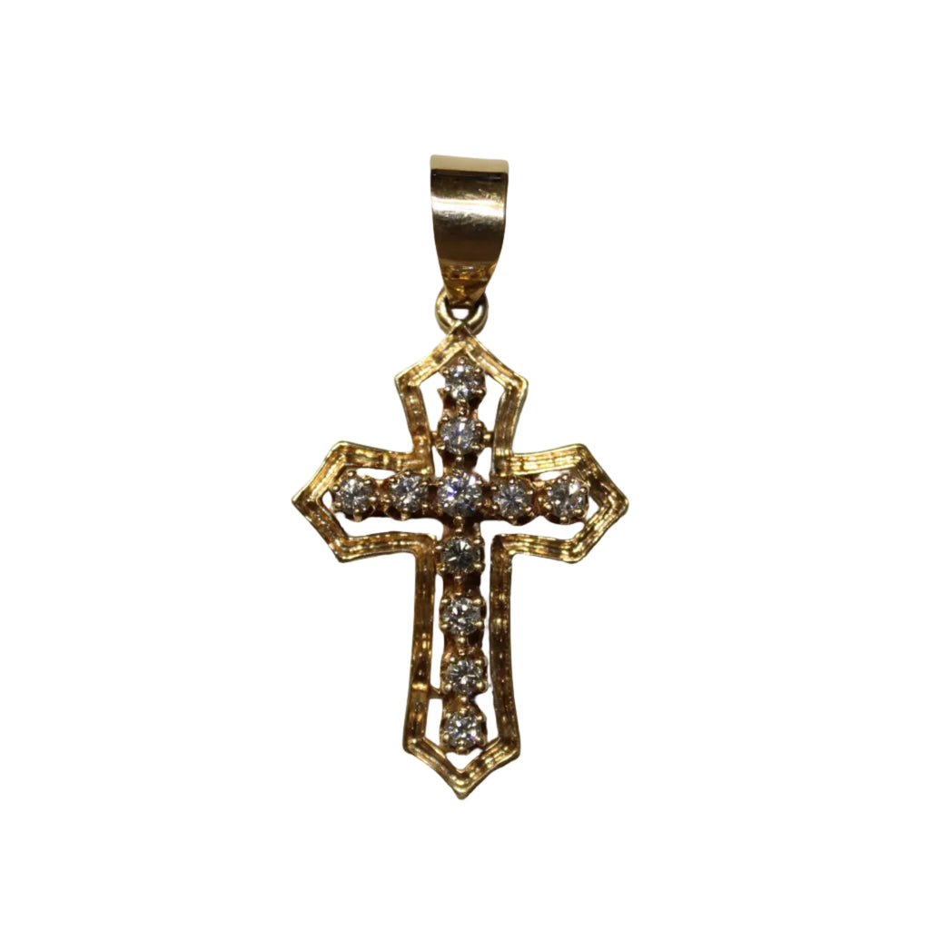 Gold cross pendant with embedded stones on a white background