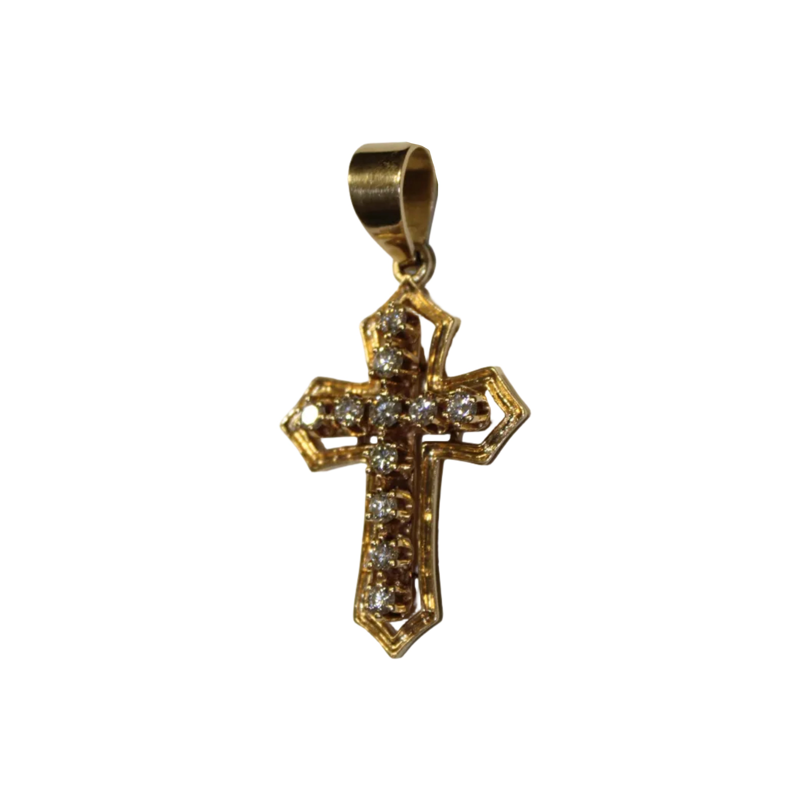 Gold cross pendant with diamonds on a beige background