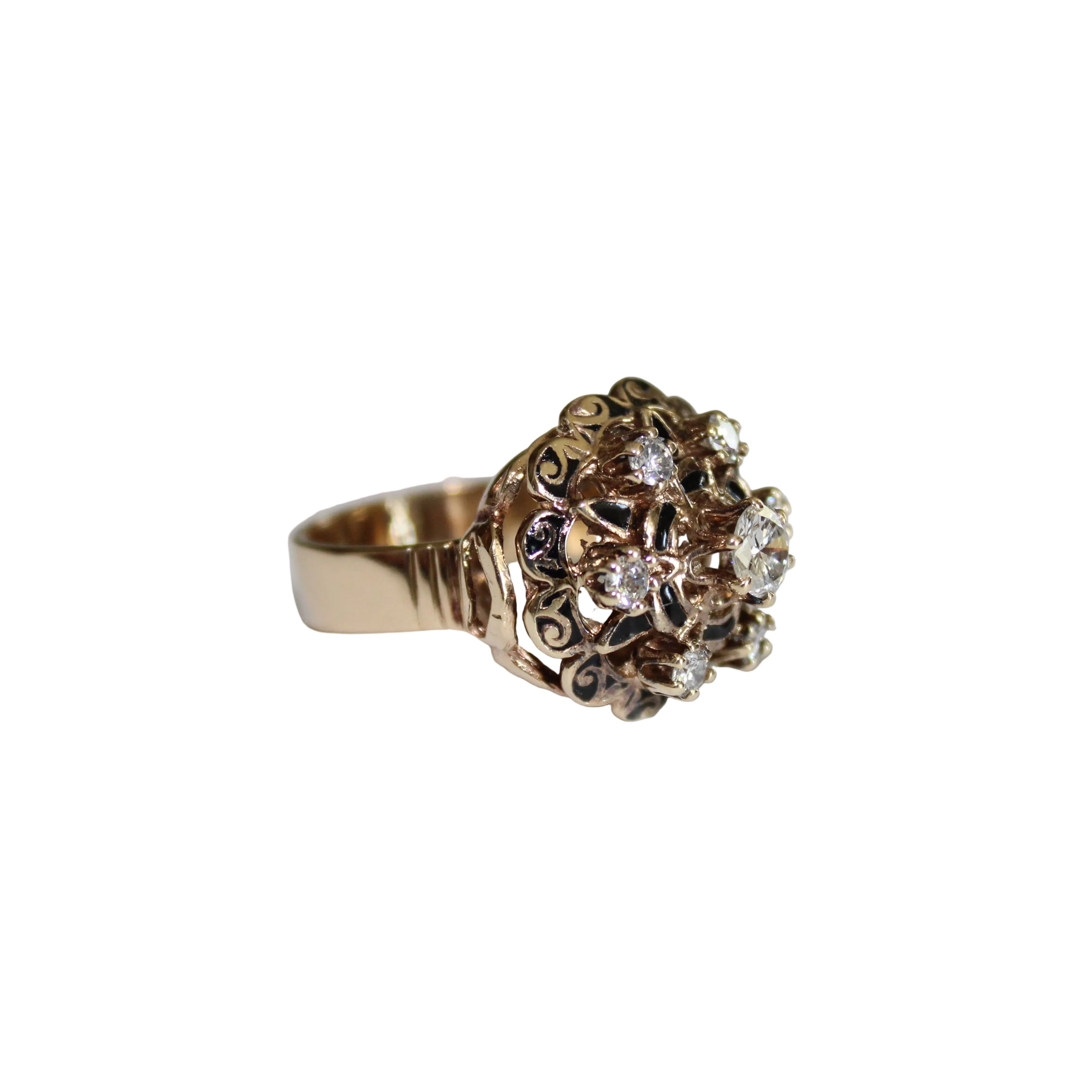 Gold ring with diamonds on a light gray background