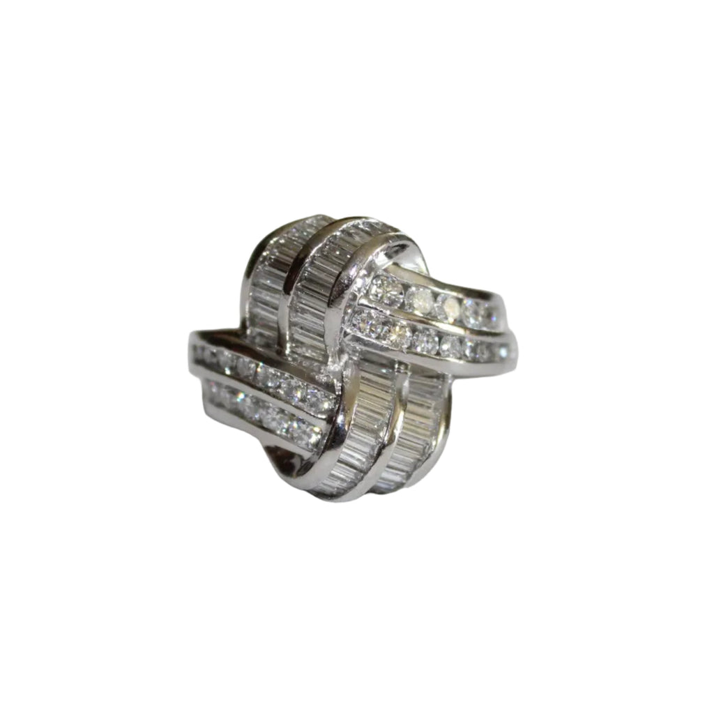 Platinum ring with diamond accents on a white background