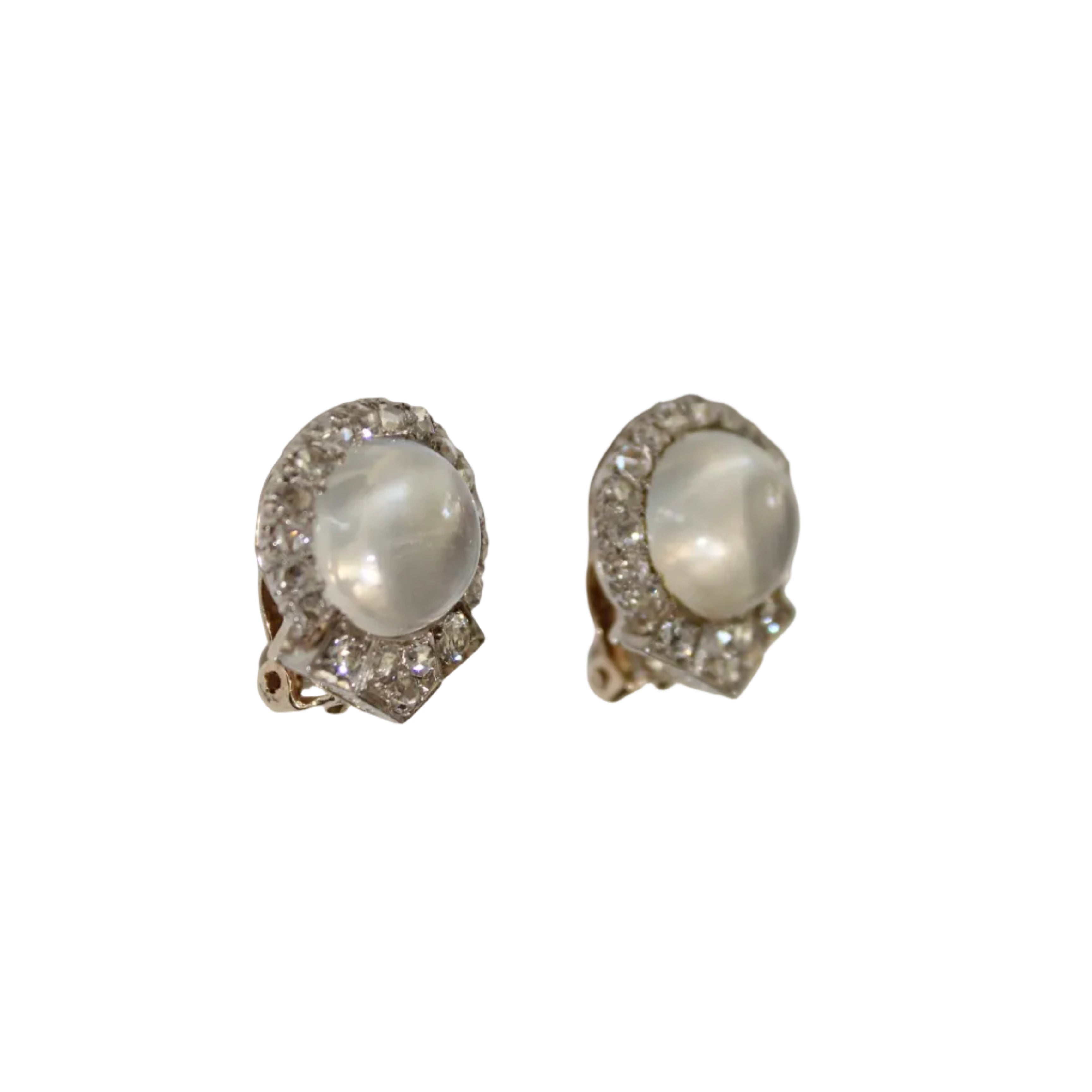 Pair of earrings with gemstones on a light gray background