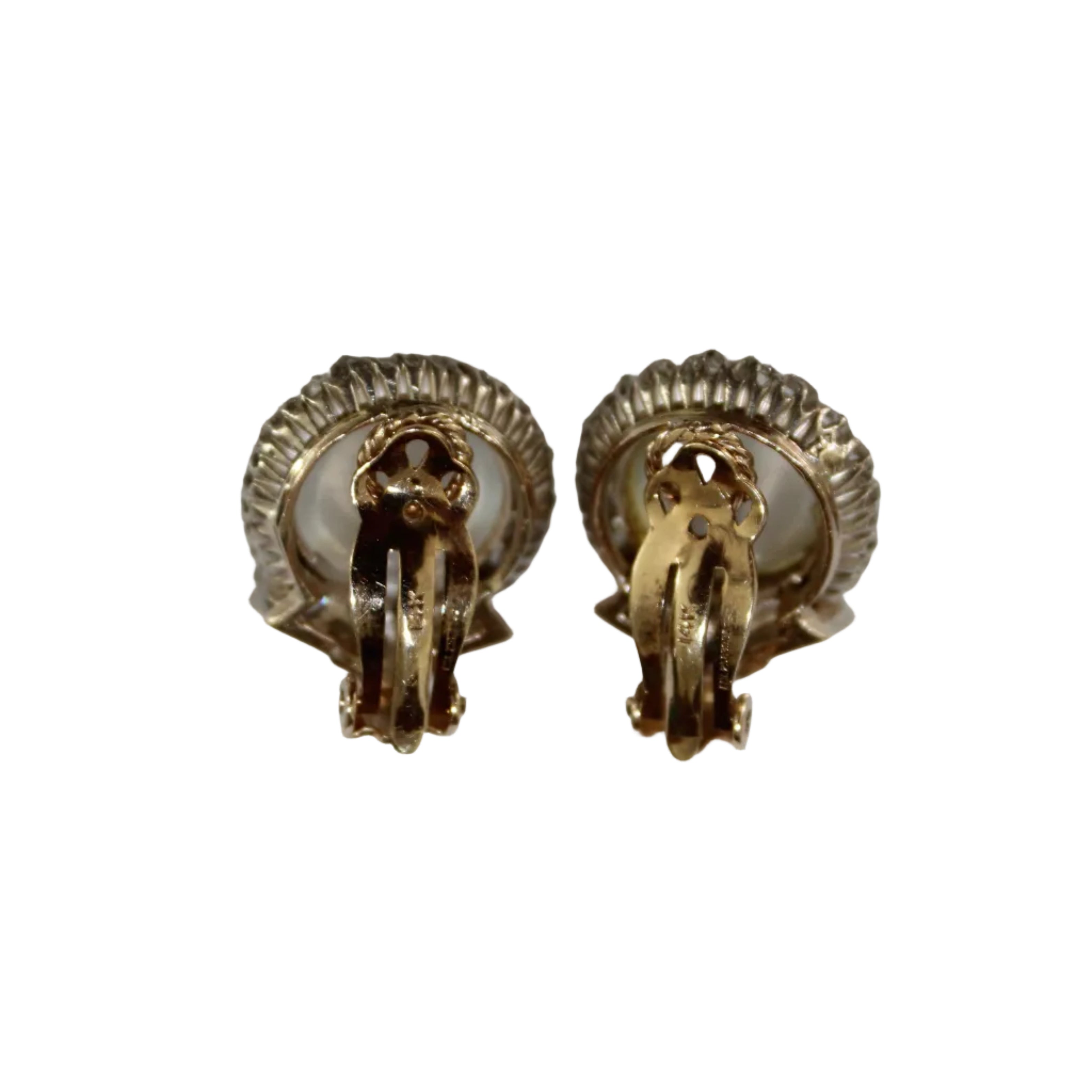 Pair of gold earrings on a white background