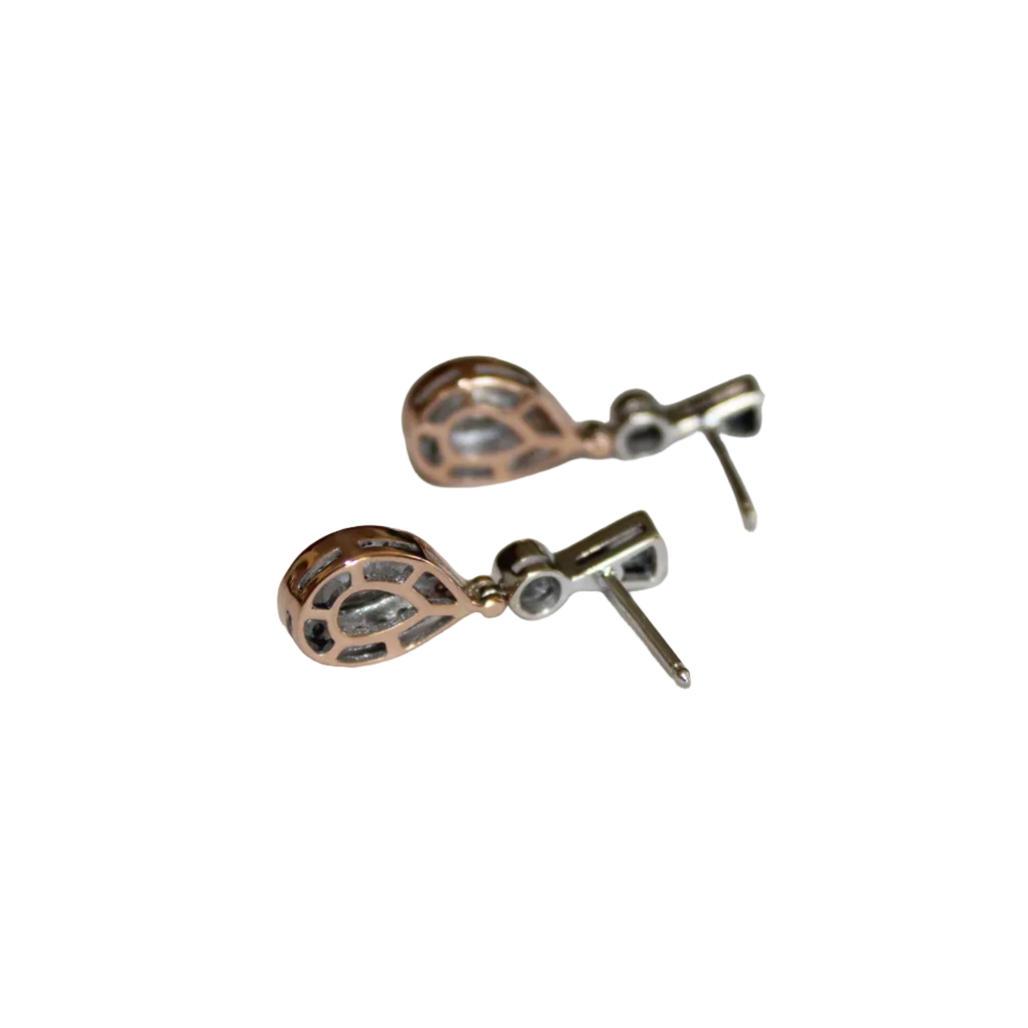 Pair of rose gold earrings on a light gray background